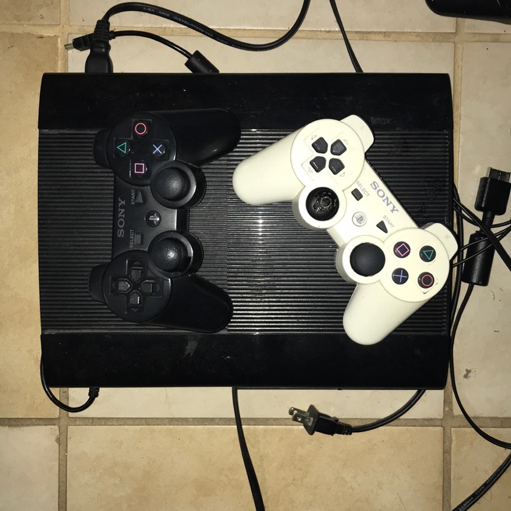 PS3 with two controllers and games